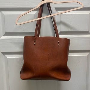 Leather purse. Color is true in photos. Brownish with orangey tone
